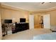Bright main bedroom with a dresser, large windows and access to a hallway at 1065 Independence Dr, Larkspur, CO 80118