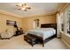 Spacious main bedroom with a king bed, exercise equipment, and large windows at 1065 Independence Dr, Larkspur, CO 80118