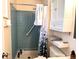 Bathroom with shower stall, toilet and small cabinet at 9464 Newton St, Westminster, CO 80031