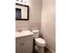 Bathroom with white vanity, toilet, and tiled walls at 9464 Newton St, Westminster, CO 80031