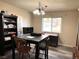 Dining room with a table, chairs, and built-in shelving at 9464 Newton St, Westminster, CO 80031