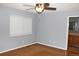 Bedroom with grey walls, cork flooring, and bathroom access at 5175 S Uravan Pl, Centennial, CO 80015