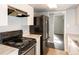 Modern kitchen with stainless steel appliances and white cabinetry at 9725 E Harvard Ave # 440, Denver, CO 80231