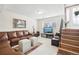 Finished basement Gathering room with a staircase and lots of natural light at 5948 Routt St, Arvada, CO 80004