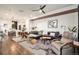 Open concept living area with hardwood floors and modern furniture at 5316 Spalding Pl, Frederick, CO 80504