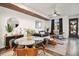 Modern dining area with glass table and mid-century modern chairs at 5316 Spalding Pl, Frederick, CO 80504