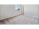 Empty bedroom with gray carpet and a window at 3453 N Irvington St, Aurora, CO 80019