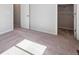 Empty bedroom featuring carpet and closet space at 3453 N Irvington St, Aurora, CO 80019