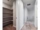 Hallway with a linen closet and carpeted stairs at 3453 N Irvington St, Aurora, CO 80019