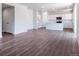 Open kitchen and living area with wood-look flooring and recessed lighting at 3453 N Irvington St, Aurora, CO 80019