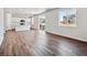 Open-concept kitchen and living area with sliding glass doors to backyard at 3453 N Irvington St, Aurora, CO 80019