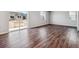 Spacious living room with wood-style flooring and access to the backyard at 3453 N Irvington St, Aurora, CO 80019