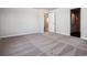 Main bedroom with neutral-toned carpeting and an ensuite bathroom at 3453 N Irvington St, Aurora, CO 80019