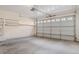 Attached garage with overhead storage shelving at 8326 Stonybridge Cir, Highlands Ranch, CO 80126