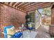 Brick patio with pergola, seating area, and lush landscaping at 2645 Ash St, Denver, CO 80207