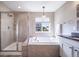 Spa-like bathroom with a soaking tub, shower, and updated vanity at 12035 Fontberry St, Parker, CO 80134