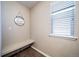 Laundry room with built-in shelving and bench at 12035 Fontberry St, Parker, CO 80134