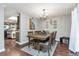 Spacious dining area with hardwood floors and a rustic wooden table at 11507 Depew Ct, Broomfield, CO 80020