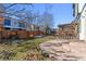 Backyard with patio, pergola, and partial view of neighboring houses at 15386 E 101St Pl, Commerce City, CO 80022