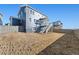 Large backyard with a deck and two-story home at 959 Eldorado Ln, Louisville, CO 80027
