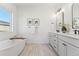 Elegant bathroom with double vanity and soaking tub at 959 Eldorado Ln, Louisville, CO 80027