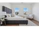 Comfortable bedroom with large windows and an accent chair at 959 Eldorado Ln, Louisville, CO 80027