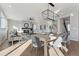 Bright dining room with hardwood floors and modern chandelier at 959 Eldorado Ln, Louisville, CO 80027