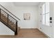 Modern entryway with wood floors and an elegant staircase at 959 Eldorado Ln, Louisville, CO 80027