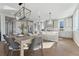 Open concept kitchen with island, hardwood floors, and modern lighting at 959 Eldorado Ln, Louisville, CO 80027