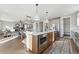 Open concept kitchen with island, stainless steel appliances, and breakfast bar at 959 Eldorado Ln, Louisville, CO 80027