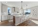 Modern kitchen with white cabinets, quartz countertops and stainless steel appliances at 959 Eldorado Ln, Louisville, CO 80027