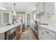 Modern kitchen with stainless steel appliances and white cabinets at 959 Eldorado Ln, Louisville, CO 80027