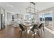 Bright kitchen with island, stainless steel appliances, and white cabinets at 959 Eldorado Ln, Louisville, CO 80027