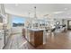 Open concept kitchen with large island, hardwood floors, and modern finishes at 959 Eldorado Ln, Louisville, CO 80027