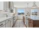 Modern kitchen with stainless steel appliances and white shaker cabinets at 959 Eldorado Ln, Louisville, CO 80027