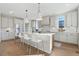 Modern kitchen with white cabinets, quartz countertops, and an island at 959 Eldorado Ln, Louisville, CO 80027