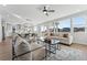 Bright and spacious living room with large windows, hardwood floors, and comfortable furniture at 959 Eldorado Ln, Louisville, CO 80027