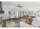 Open concept living room with hardwood floors and a cozy fireplace at 959 Eldorado Ln, Louisville, CO 80027