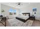 Main bedroom with wood floors, ceiling fan, and en-suite bathroom at 959 Eldorado Ln, Louisville, CO 80027
