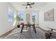 Home office with hardwood floors, large windows, and ceiling fan at 959 Eldorado Ln, Louisville, CO 80027