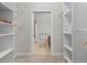 Spacious walk-in closet with built-in shelving and hanging rods at 7240 W Custer Ave # 119, Lakewood, CO 80226