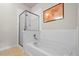 Bathroom with a bathtub, shower, and updated vanity at 13456 Via Varra # 233, Broomfield, CO 80020