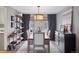 Elegant dining room with a large table and rustic wood floors at 5262 E Maplewood Pl, Centennial, CO 80121