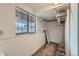 Basement laundry room with shelving and window at 492 S Kalispell Way # C, Aurora, CO 80017