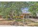 Brick ranch home with mature trees and a carport at 1125 Edinboro Dr, Boulder, CO 80305