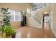 Bright living room with hardwood floors, high ceilings, and large windows at 33 Gaviota Ave, Brighton, CO 80601