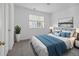 Bright bedroom with a queen-size bed, window, and neutral color scheme at 33 Gaviota Ave, Brighton, CO 80601