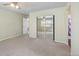 Spacious bedroom with mirrored closet doors and ceiling fan at 33 Gaviota Ave, Brighton, CO 80601