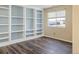 Spacious home office with extensive built-in shelving at 33 Gaviota Ave, Brighton, CO 80601