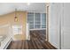 Upper hall with built-in shelving and hardwood floors at 33 Gaviota Ave, Brighton, CO 80601